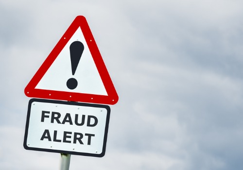 A warning sign notifying people of fraud